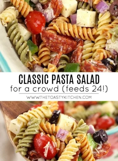 A bowl of classic pasta salad with colorful vegetables and dressing