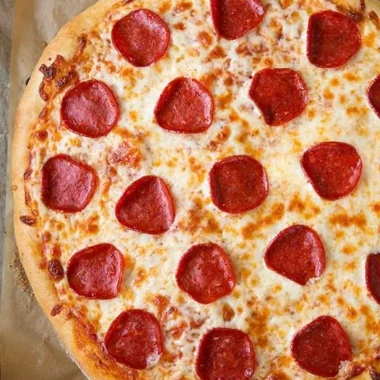Delicious slice of pepperoni pizza with melted cheese and toppings