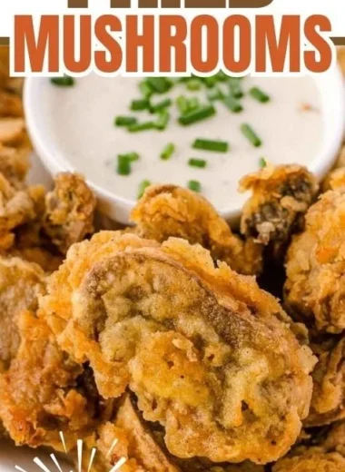 Plate of crispy fried mushrooms served with dipping sauce