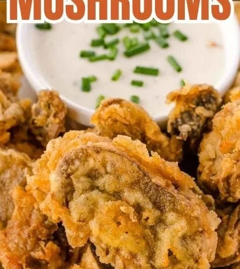 Plate of crispy fried mushrooms served with dipping sauce