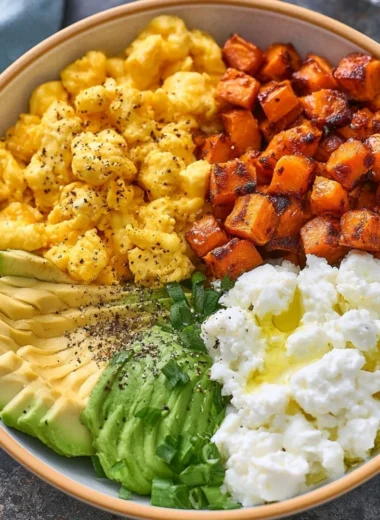 High-protein breakfast bowl filled with eggs, veggies, and quinoa