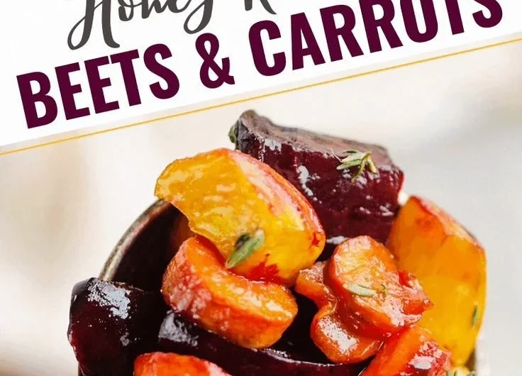 Plate of honey roasted beets and carrots garnished with herbs