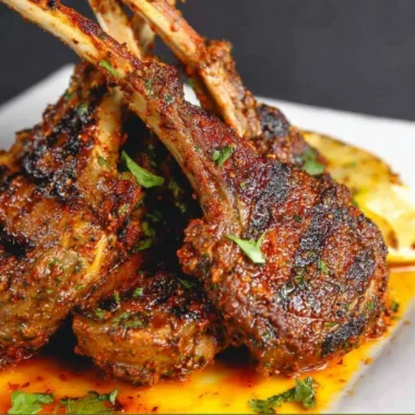 Oven-baked lamb chops with herbs and spices on a plate