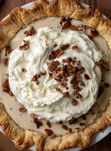 Delicious Pecan Cream Pie with a rich, creamy filling and topped with pecans
