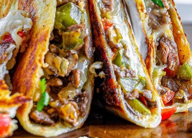 Philly Cheesesteak Quesadilla with melted cheese and beef filling