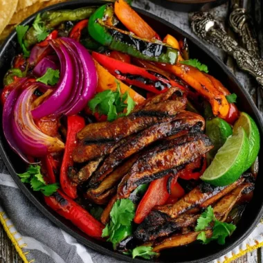 Colorful Portobello Vegan Fajitas served on a plate with peppers and onions