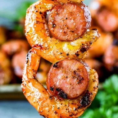 Grilled Sausage & Shrimp Kabobs on skewers served with vegetables