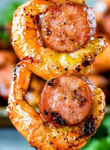 Grilled Sausage & Shrimp Kabobs on skewers served with vegetables