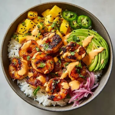 Delicious charred shrimp and avocado bowl served in a vibrant dish