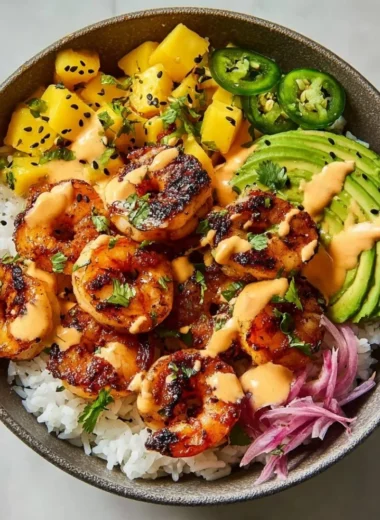 Delicious charred shrimp and avocado bowl served in a vibrant dish