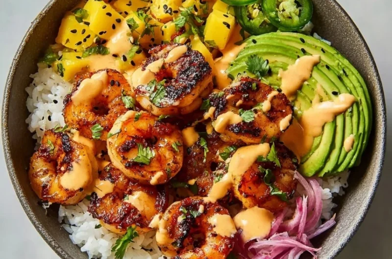 Delicious charred shrimp and avocado bowl served in a vibrant dish