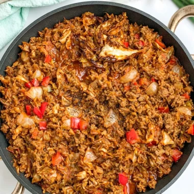 Delicious African cabbage stew with ground beef in a rustic bowl.
