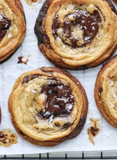 Freshly baked chewy chocolate chip cookies on a cooling rack