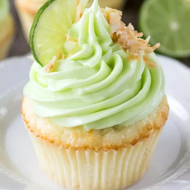 Coconut cupcakes with lime frosting on a decorative plate