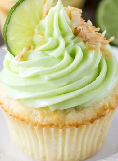 Coconut cupcakes with lime frosting on a decorative plate