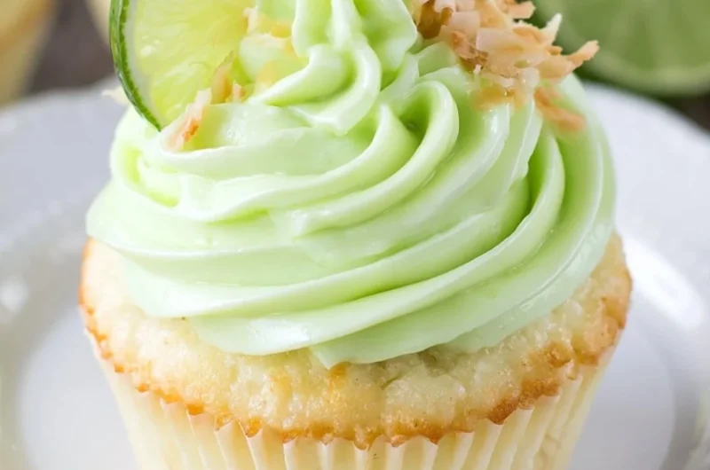 Coconut cupcakes with lime frosting on a decorative plate