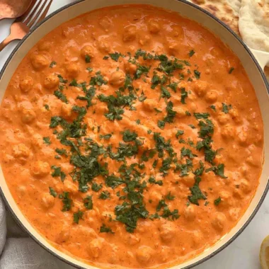 Cozy Indian Butter Chickpeas in a creamy tomato sauce served with rice