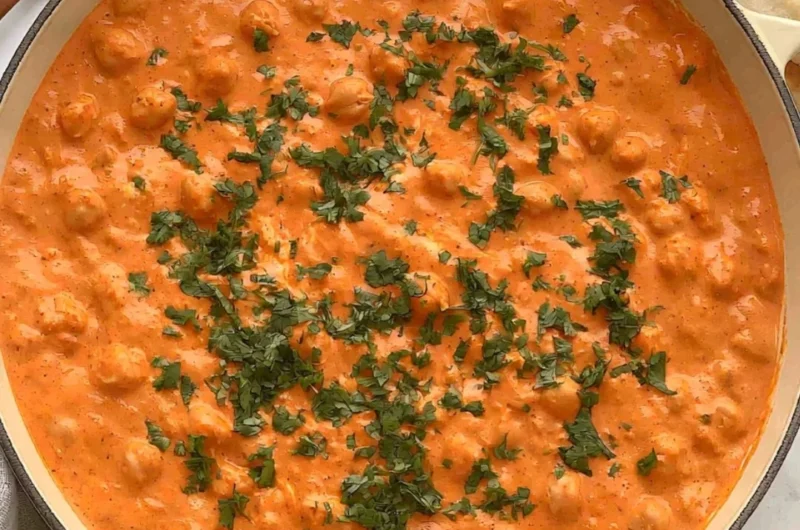 Cozy Indian Butter Chickpeas in a creamy tomato sauce served with rice