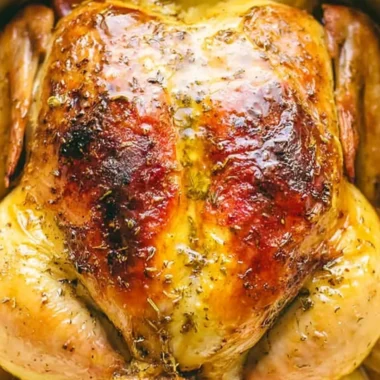 Tender Dutch Oven whole chicken with crispy skin and herbs