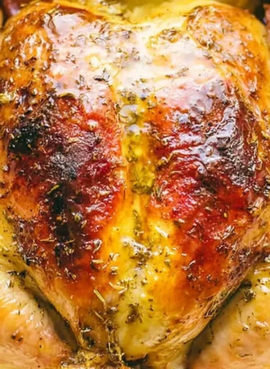 Tender Dutch Oven whole chicken with crispy skin and herbs