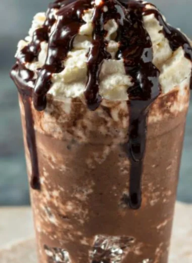 Delicious Iced Mocha Coffee served in a glass with chocolate drizzle