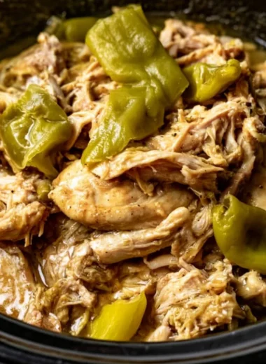 A delicious plate of Mississippi Chicken with creamy sauce and spices.