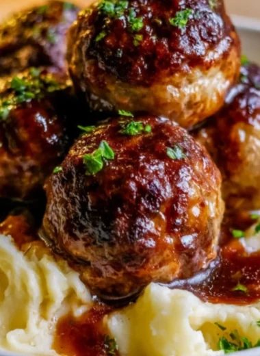 Salisbury steak meatballs served with garlic herb mashed potatoes