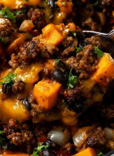 Southwestern Ground Beef Sweet Potato Skillet in a colorful cast iron pan