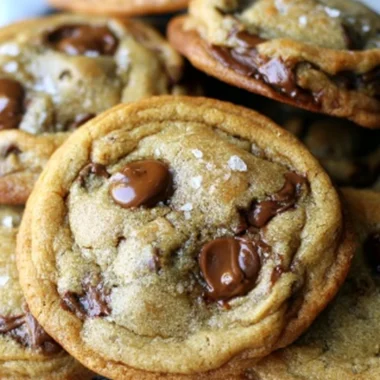 Freshly baked brown butter chocolate chip cookies on a cooling rack