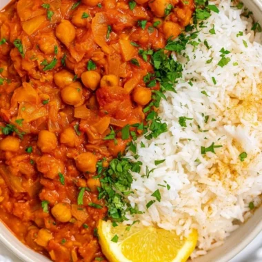 Cozy Chickpea Masala served in a bowl with fresh herbs and spices.