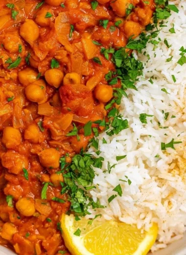 Cozy Chickpea Masala served in a bowl with fresh herbs and spices.