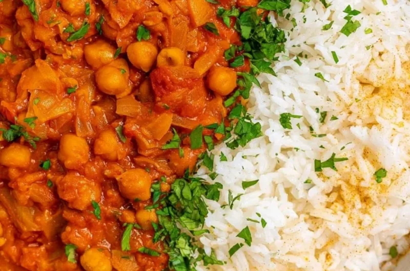 Cozy Chickpea Masala served in a bowl with fresh herbs and spices.