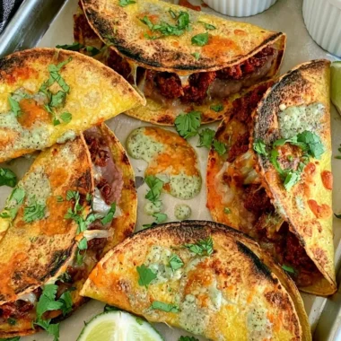 Delicious oven baked tacos served on a plate with toppings