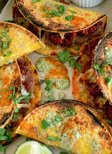Delicious oven baked tacos served on a plate with toppings