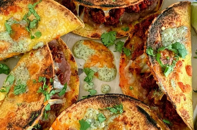 Delicious oven baked tacos served on a plate with toppings
